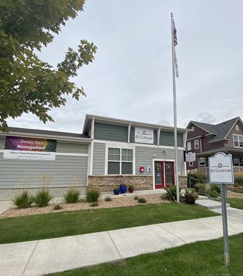 a building with a flagpole in front of it